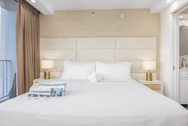 A beautifully renovated studio condo with a king-size bed and new mattress for a comfortable and relaxing sleep.