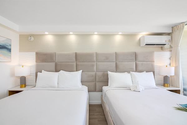 This studio has 2 queen-size beds with Beautyrest mattresses, and 2 nightstands.