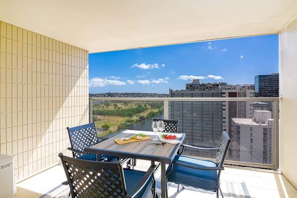 Enjoy your meals on your balcony with a table and 4 chairs and with Ala Wai Canal View and Ocean View on the other side.