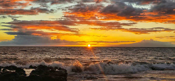 Witness a spectacular Kamaole Beach sunset just moments from the property, painting the sky in brilliant shades of orange and gold as waves crash gently onto the shore this stunning view is your unforgettable island farewell every evening.