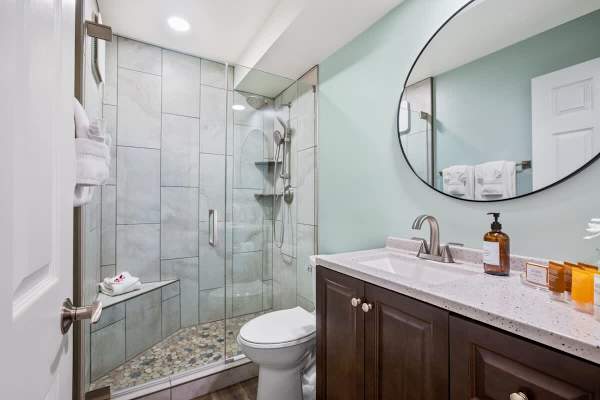 Full bathroom with walk-in shower.