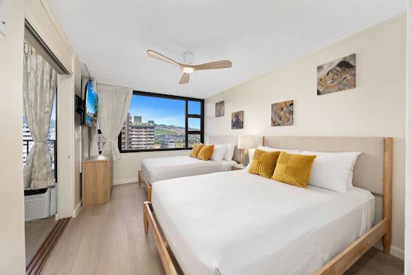 The bedroom has a flatscreen TV, a queen-size bed, and a full-size bed perfect for your relaxation!