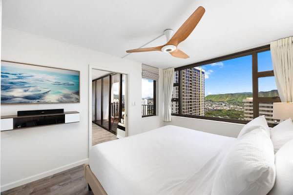 Bedroom with a king-sized bed and 55" QLED Frame TV for your entertainment