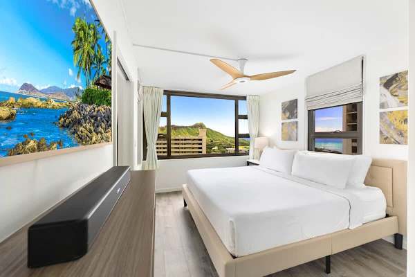 Bedroom with a king-sized bed and 55" QLED Frame TV for your entertainment