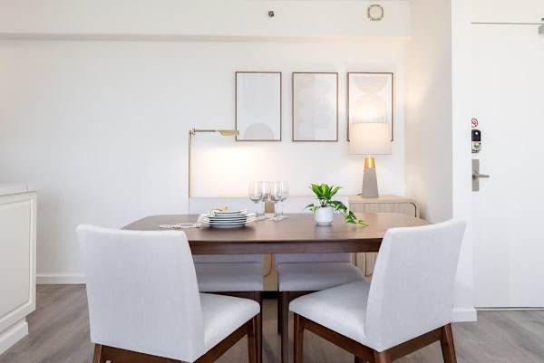 Enjoy your meals in our dining area, which features a table and four chairs.
