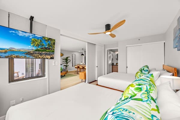 Enjoy watching TV while relaxing in your bedroom with 2 queen-sized beds