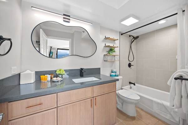 Full bathroom with vanity, and shower & tub combination