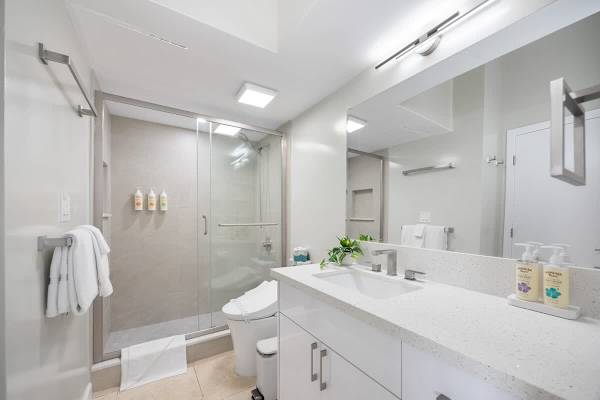 Full bathroom with vanity and walk-in shower