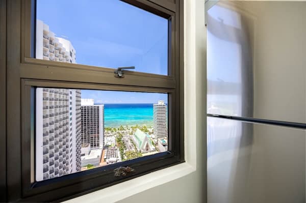 Full-equipped kitchen with a view of the ocean from the window