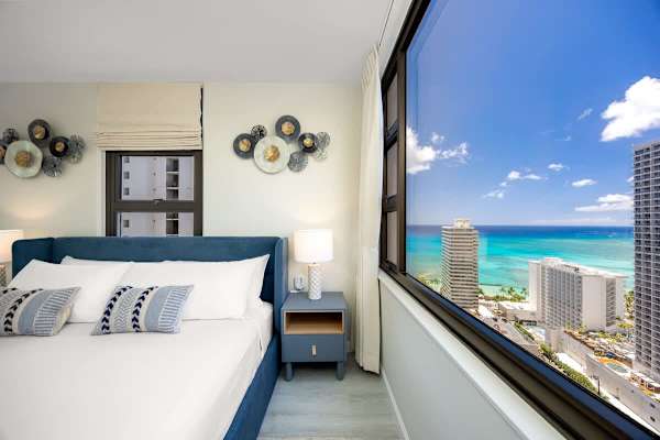 King-sized bed in the bedroom with great ocean views from the window