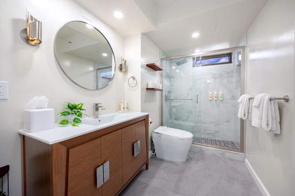 Get ready for the day in our full bathroom with a beautiful vanity and a walk-in shower where you can choose between a rain shower or handheld. The toilet also features a bidet. We provide all toiletries for your convenience