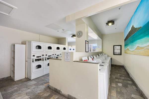 Shared space laundry area on the 6th floor with coin and card-operated washers and dryers