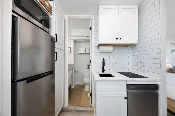 Cook your meals in the kitchenette with a full-size refrigerator and a dishwasher! Plus, this is where you can access the bathroom.