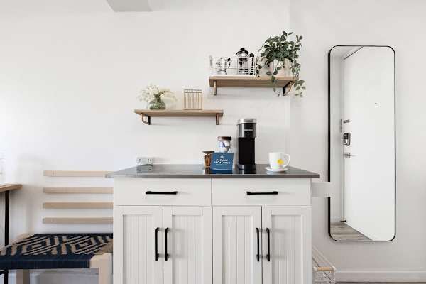 This is where the coffee station is located plus there is a long body mirror in front of the bathroom door!