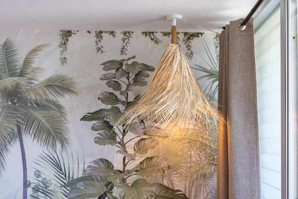 Bring the tropics indoors with this stylish natural fiber pendant light, beautifully illuminating the room.