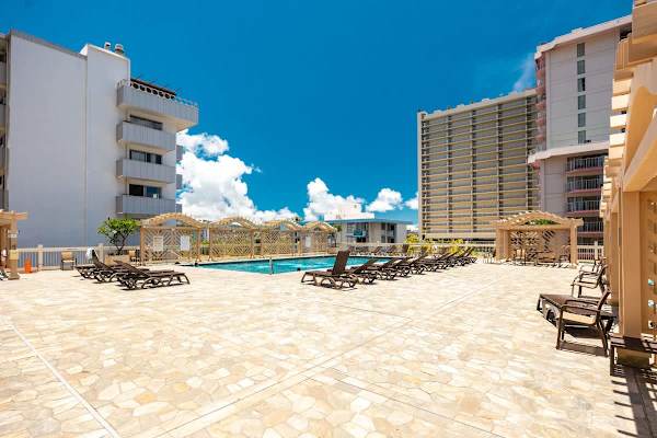 Take a refreshing dip in our sparkling outdoor pool, surrounded by comfortable lounge chairs and shaded cabanas, perfect for soaking up the Hawaiian sun.