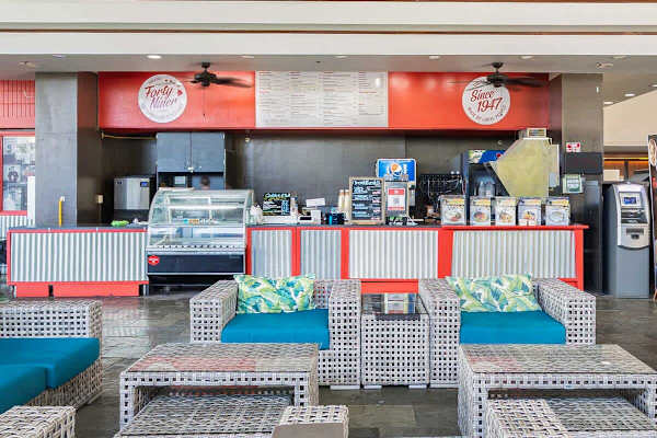 Relax in the inviting common area, featuring comfortable seating and a convenient snack bar!