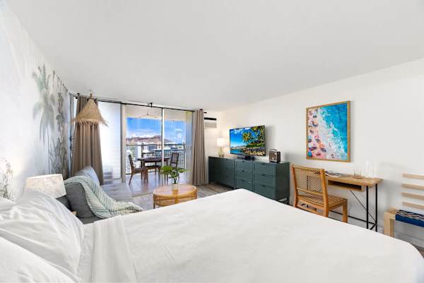 Relax on your queen-size bed while watching your favorite show in this air-conditioned room!
