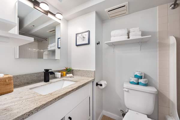 Full bathroom equipped with starter supplies such as shampoo, conditioner, soap, toilet paper, plus a bath towel for each guest!