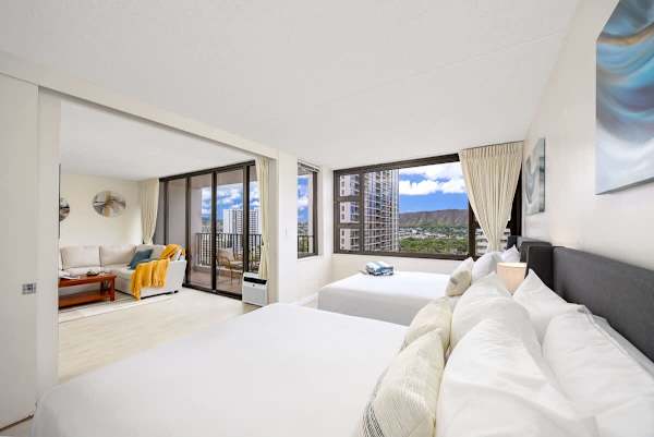 Relax in this bright bedroom with 2 Queen-size beds while enjoying the beautiful views from the large window