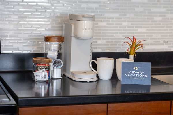 Enjoy your morning brew with a convenient Keurig coffee maker and a selection of coffee pods, perfectly set up on your sleek countertop