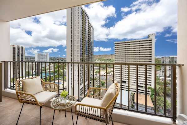 Step out onto your private balcony and soak in breathtaking views of the city skyline and Diamond Head, all from the comfort of stylish outdoor seating