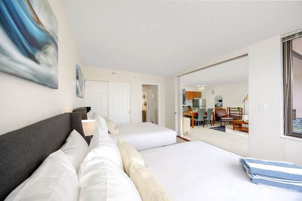 Discover seamless living with a convenient sliding door that elegantly separates the comfortable bedroom from the spacious, inviting living area