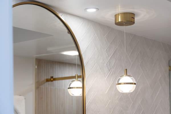 Indulge in sophisticated comfort within your beautifully appointed bath, where elegant fixtures and stylish details create a spa-like retreat.