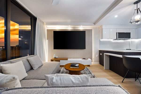 Witness breathtaking sunsets from the modern comfort of your stylish open-concept living and kitchen area.