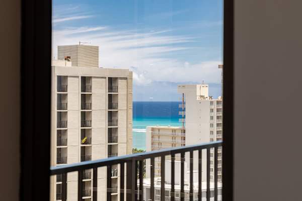 Glimpse the endless blue of the Pacific Ocean from your balcony, a constant reminder of Hawaii's breathtaking beauty.