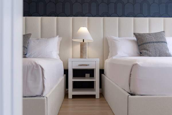 Drift into peaceful slumber in your beautifully designed bedroom, offering 2 queen beds and elegant decor for a serene escape.