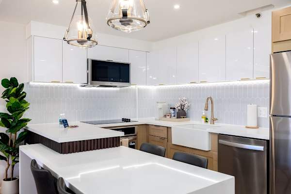 Whip up delicious meals in your modern kitchen, fully equipped with a refrigerator, stovetop, microwave, and dishwasher for all your culinary needs.