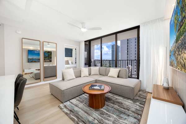 Welcome to our newly renovated unit! Stay in this bright, modern living space featuring a sectional sofa and expansive windows opening to beautiful city, mountain, and partial ocean views!