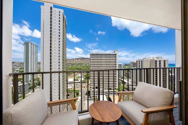 Step out onto your private lanai and immerse yourself in breathtaking Hawaiian views, from Diamond Head to the distant sparkling ocean, creating unforgettable memories.