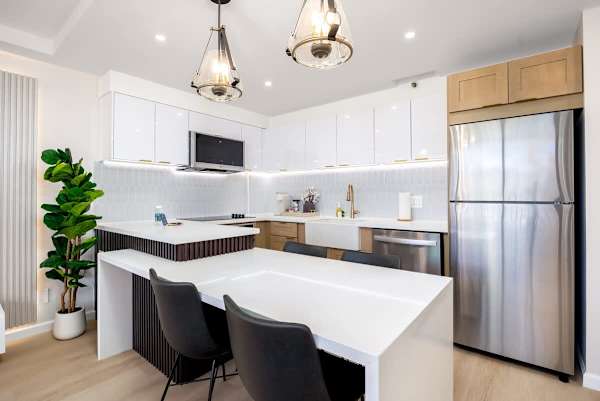Whip up delicious meals in your modern kitchen, fully equipped with a refrigerator, stovetop, microwave, and dishwasher for all your culinary needs.