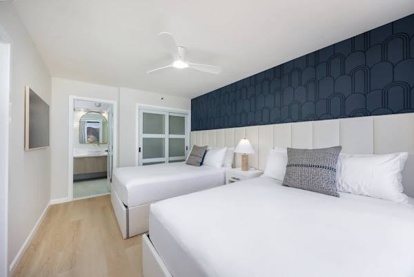 Get ready for restful nights in your Hawaiian haven, featuring two comfy queen beds and a 55" flat-screen TV perfect for unwinding after island adventures.