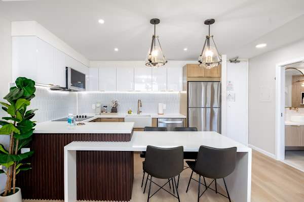 Create culinary delights in your sleek and spacious kitchen, boasting modern appliances and an inviting island for all your dining needs.