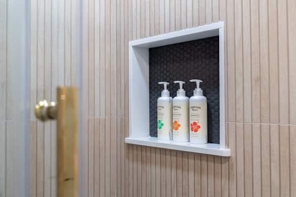 Indulge in refreshing moments with your complimentary Hawaiian bath essentials, thoughtfully provided for a truly serene shower experience.