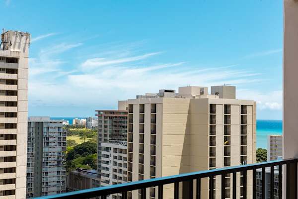 From your private balcony, soak in breathtaking panoramic views of Waikiki, stretching from the vibrant city to the sparkling ocean.