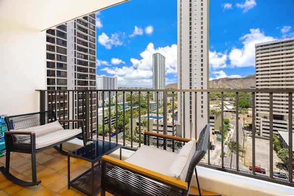 Sip your morning coffee or enjoy an evening breeze from your private balcony, offering captivating cityscapes and a glimpse of Diamond Head.