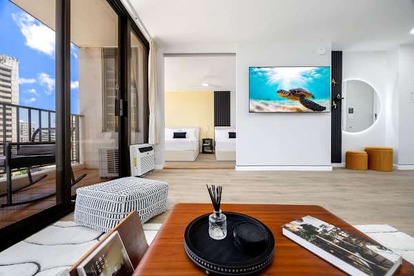 Unwind in style with an open-concept layout featuring a living area, a large 65" smart TV for entertainment, and breathtaking outdoor views.