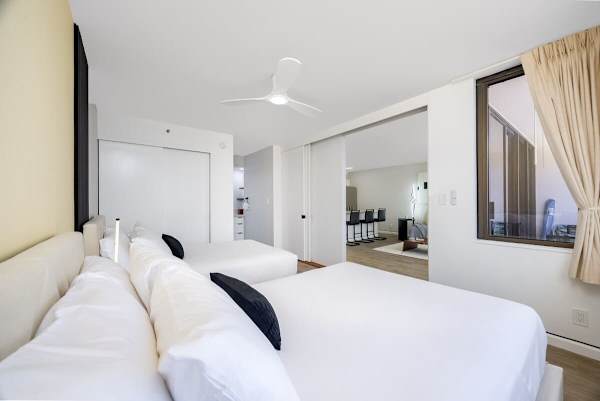 Enjoy privacy and comfort in a bright bedroom, thoughtfully separated from the living area by a modern sliding door.