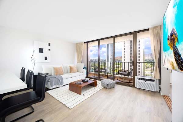 Your perfect retreat awaits, offering an inviting living room with direct balcony access, ideal for unwinding after a day of exploration.