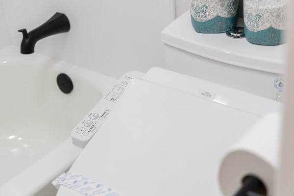 Experience enhanced comfort and hygiene with our modern bidet-equipped toilet, ensuring a refreshing stay.