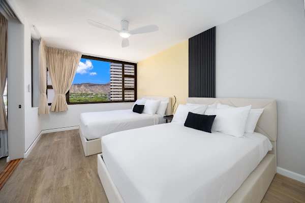 Wake up to stunning views and unwind in a tastefully designed bedroom with a queen and a full-size bed equipped for ultimate relaxation and peaceful sleep.
