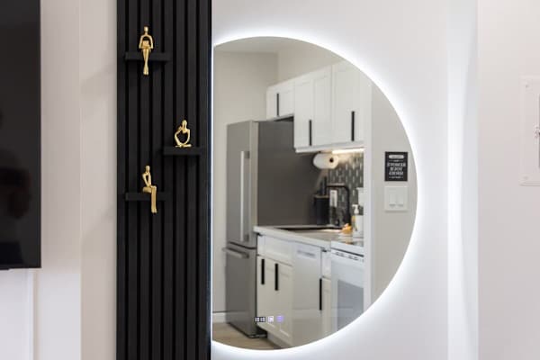 A stylish backlit mirror that enhances the elegance of the unit.