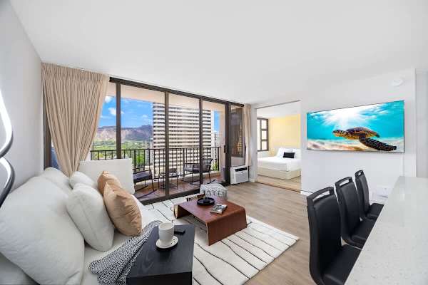 Unwind in style with an open-concept layout featuring a living area, a large 65" smart TV for entertainment, and breathtaking outdoor views.