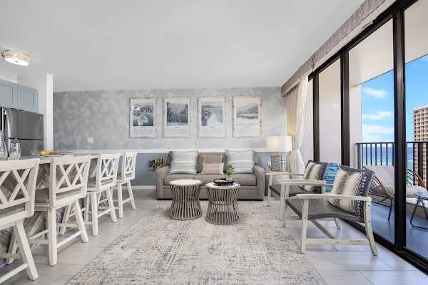 Maximize your space with this thoughtfully designed living room, complete with a cozy sleeper sofa and seamless flow to the outdoor balcony.