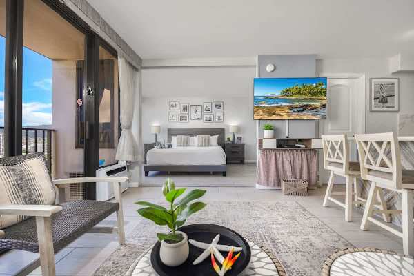 Relax in this inviting living space, thoughtfully designed with a comfortable seating area, modern decor, and a large flat-screen TV.