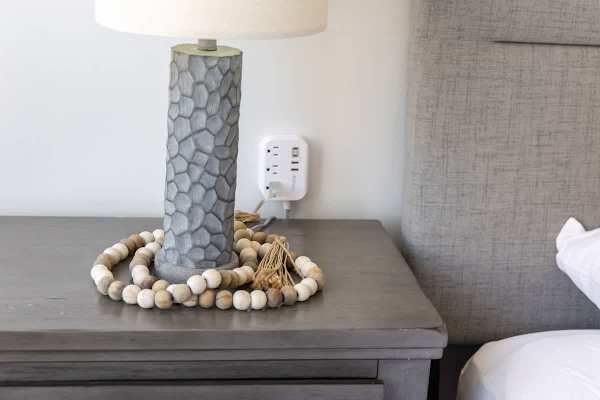 Stay connected and comfortable with convenient charging right by your bedside.